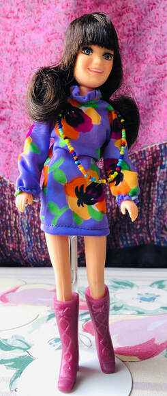 Hasbro World of Love doll named Music. She is the 5th doll in the collection.